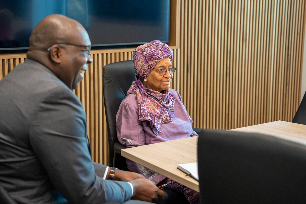 Image of Bonny Ibhawoh with Mme. Johnson Sirleaf in the Boardroom
