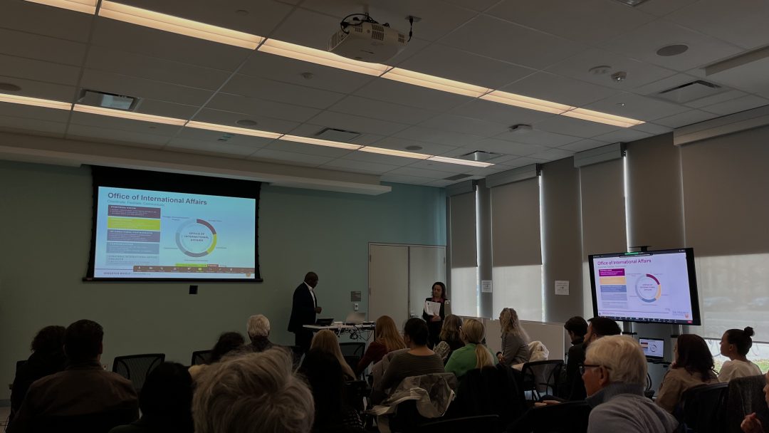 Image of Bonny Ibhawoh and Amira El Masri presenting OIA's institutional scan to McMaster faculty and staff.