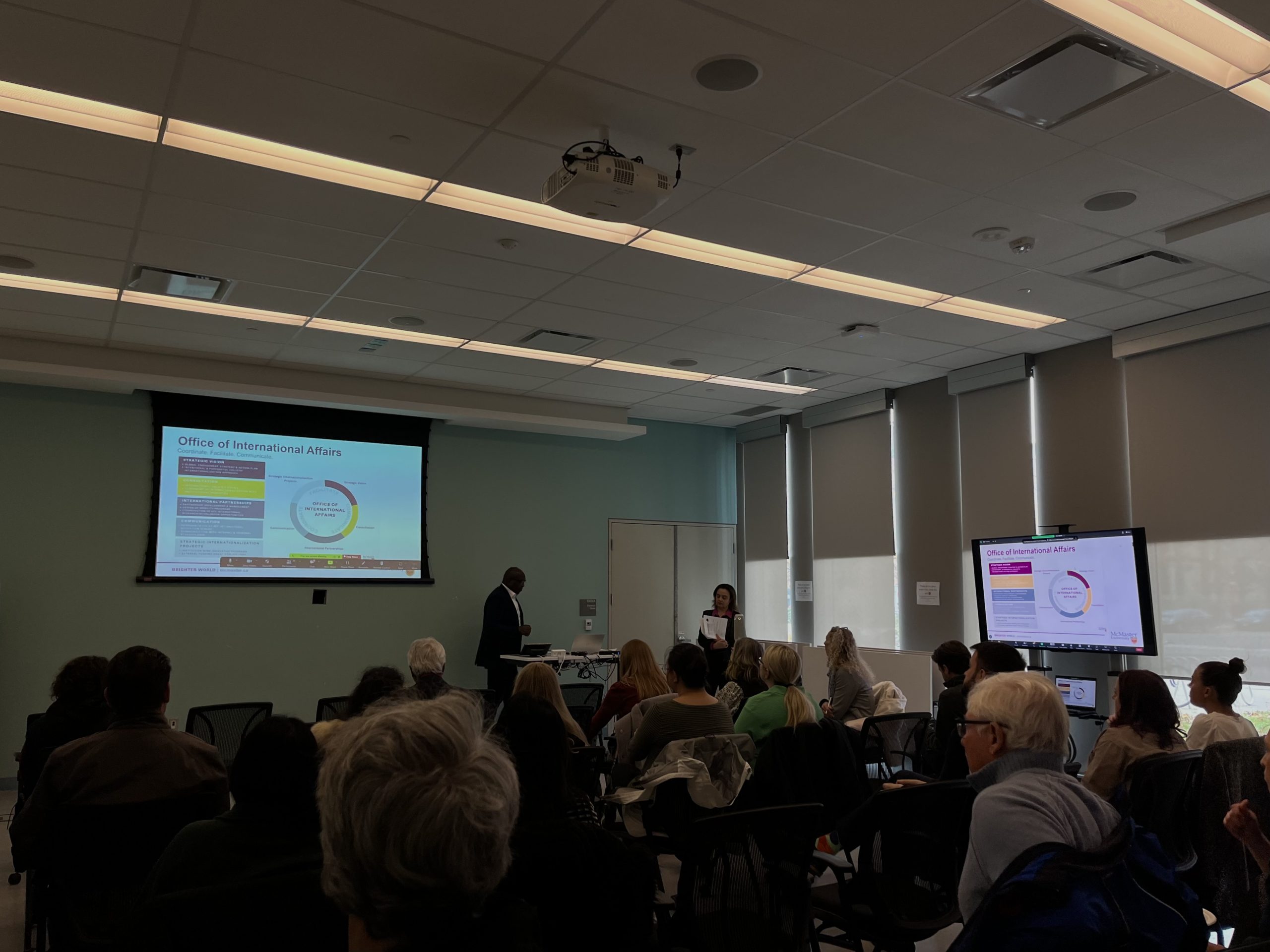 Image of Bonny Ibhawoh and Amira El Masri presenting OIA's institutional scan to McMaster faculty and staff.