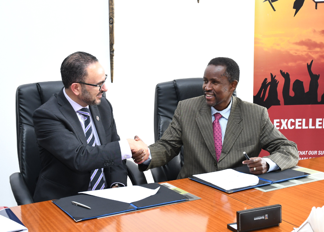 Dr. Khaled Hassanein shakes hands with Dr. Caesar J. Muriithi Mwangi after signing an MOU between McMaster and Strathmore.